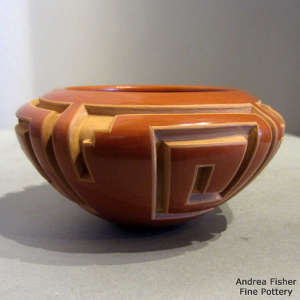 Geometric design carved into a red bowl