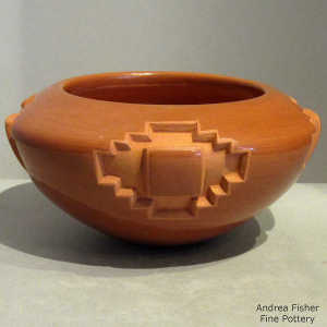 Kiva step medallion design carved into a red bowl
