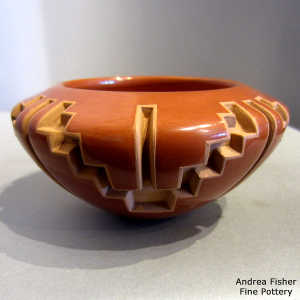 Four direction kiva step and geometric design carved into a red bowl