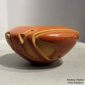 Sgraffito bear paws and heart line on a red bowl carved with a bear, kiva step, button and geometric design