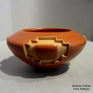 Four-panel kiva step and geometric design carved into a red bowl