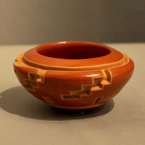 Kiva step and geometric design carved into a red bowl