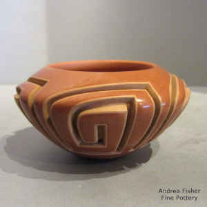 4-panel Scroll design carved into a red bowl