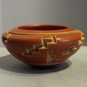 Geometric designs carved into a red jar