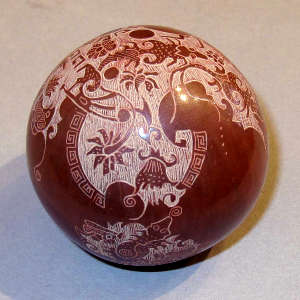 Sgraffito nature design on a miniature red seed pot