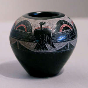 Sgraffito bird and sunrise design on a polychrome seedpot