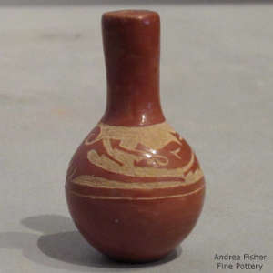 Sgraffito avanyu design on a long-neck miniature red jar