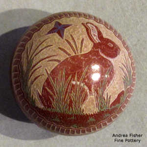 Sgraffito and painted rabbit, nature and geometric design on a polychrome seed pot