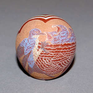 Sgraffito and painted cluds, nest and bird feeding chicks design on a polychrome seed pot