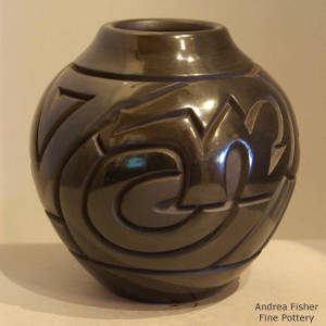 Bear and Tularosa spiral design carved into a black jar