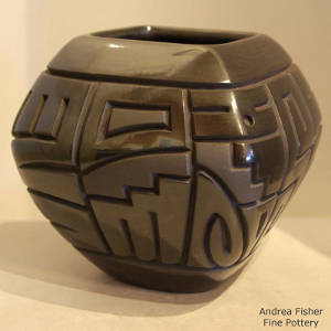 Yei design carved into a squarish black bowl