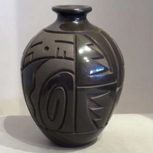 Geometric designs carved on a black on black narrow-neck jar