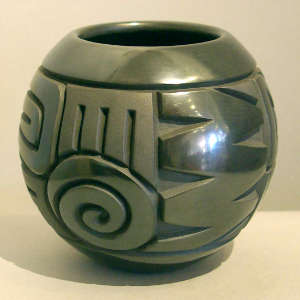Geometric design carved into a black jar