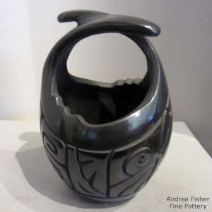 Turtle design carved into a black friendship basket