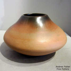Black rim and fire clouds on a brown jar