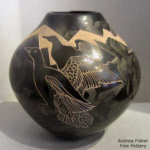 Sgraffito and painted birds, spirit birds and geometric design on a polychrome jar
