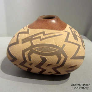 Sgraffito pronghorn and geometric design on a sienna jar