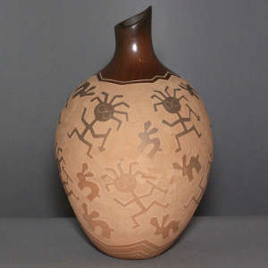 Sgraffito hunter and rabbit design on a brown jar
