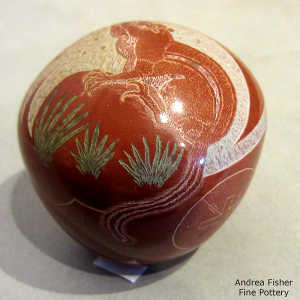 Sgraffito squirrel motif on a polychrome seed pot
