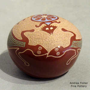 Sgraffito and pianted lizard, horned toad and geometric design on a polychrome seed pot
