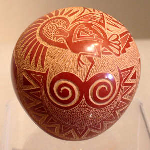 Sgraffito quail and sunface design on a red on red seed pot