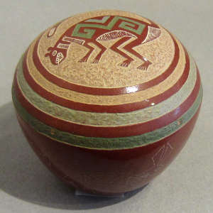 Sgraffito animals and evolution design on a red seedpot