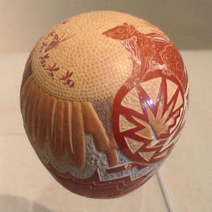 Sgraffito squirrel, butterfly and geometric design on a polychrome seedpot