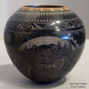 Sgraffito bear, mountain lion and eagle medallions and geometric design on a black jar