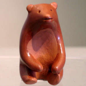Miniature red bear figure