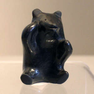 Sitting miniature black bear figure
