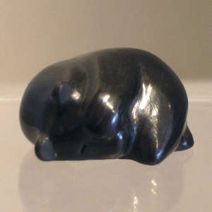 Sleeping black bear figure