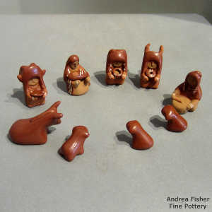 13 pieces in a red nativity set
