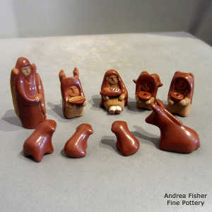 13 pieces in a red nativity set