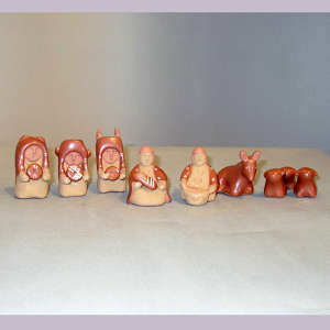 13 pieces in a red nativity set