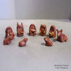 Miniature red nativity set with 13 pieces