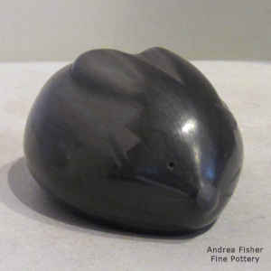 Geometric design on a black rabbit figure