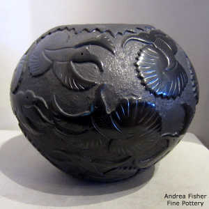 Micaceous slip and polished birds on a lightly carved black jar