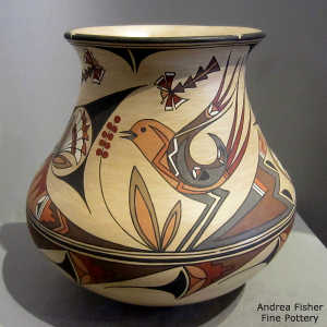 Bird, cloud and geometric design on a polychrome jar