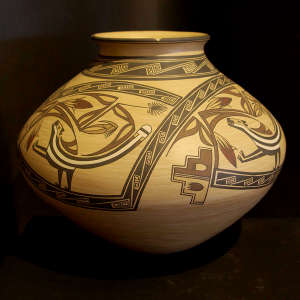 Corn, skunk and geometric design on a polychrome jar