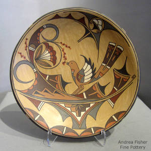 Bird, floral, cloud and geometric design on a polychrome plate