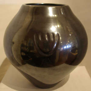 Bear paw imprint on a black jar