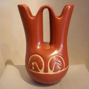 Geometric design carved into a red wedding vase