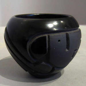 Black on black carved jar