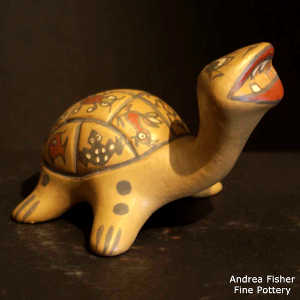 Animal, insect and geometric design on a polychrome turtle figure