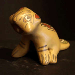 Geometric design on a polychrome beaver figure