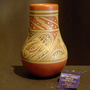 Bird, feather and geometric design on a polychrome jar