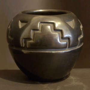 Kiva step design carved into a black jar