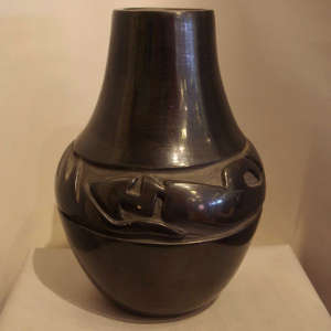 Avanyu design carved into a black jar