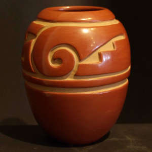 Geometric designs carved into a red jar