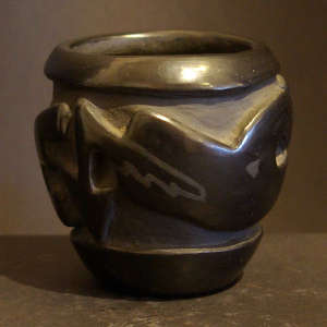 Avanyu design carved into a black jar